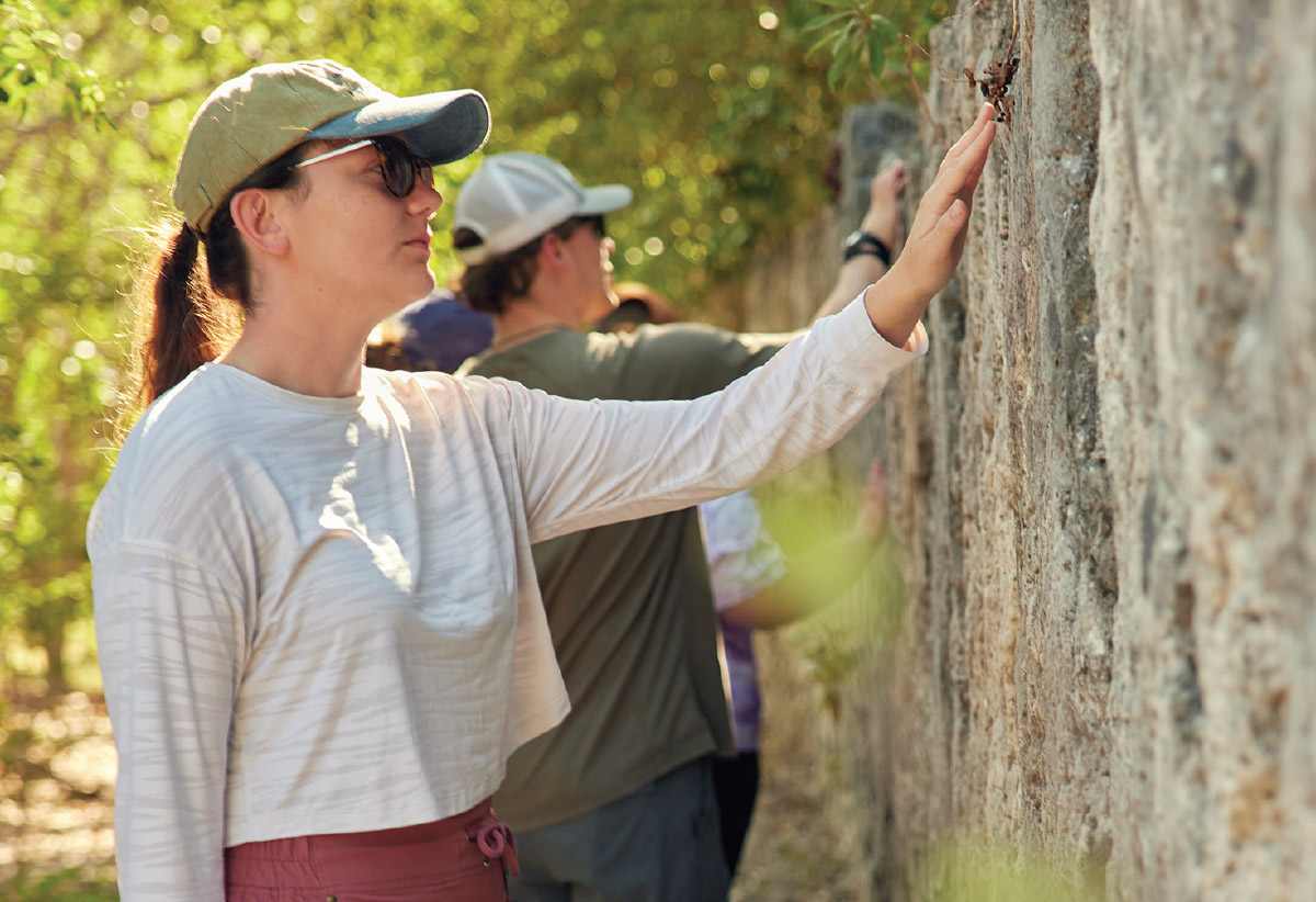 woman touching trees at Windley Key state park