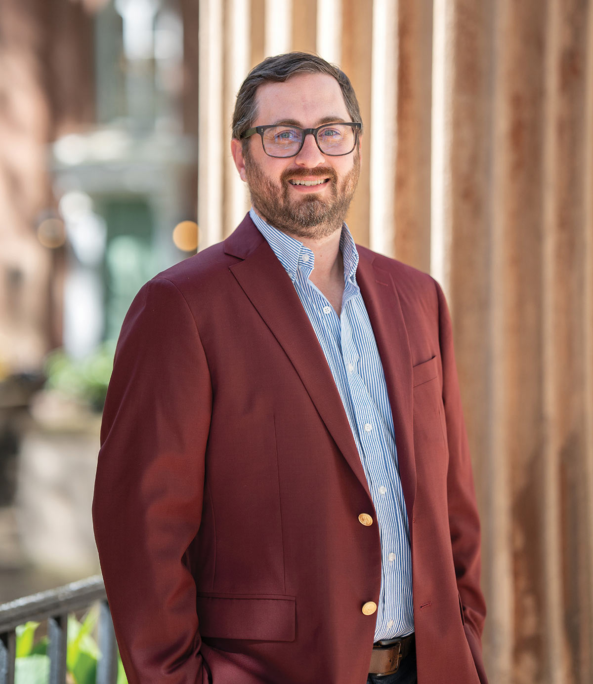 A portrait of Brady Quirk-Garvan smiling outdoors